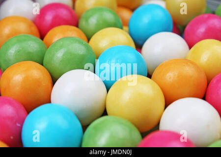 Bubble gum chewing gum texture. Rainbow multicolored gumballs chewing gums as background. Round sugar coated candy dragee bubblegum texture. Food cute Stock Photo