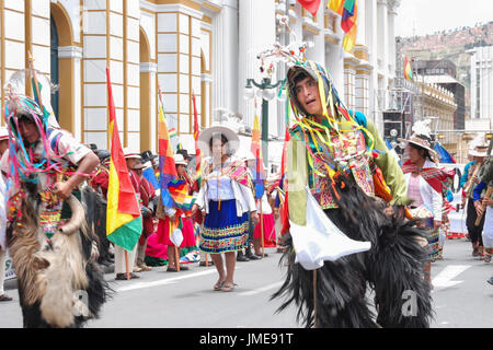 Bolivian performers in colorful traditional costumes celebrating the plurinational state foundation day, La Paz, Bolivia, South America Stock Photo