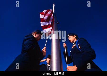 US flag raising ceremony performed by US Air Force ROTC - reserve officer training corps - high school cadets in uniform outside their high school Stock Photo