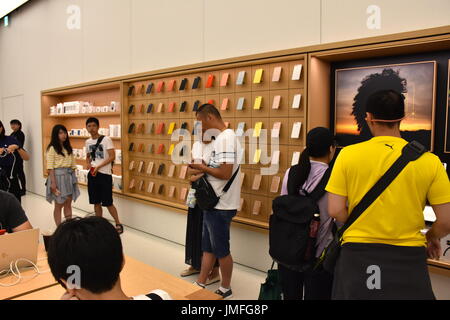 Customers exploring the Apple store at the grand opening of the 1st Apple headquarters located in Taipei 101 building, Taipei, Taiwan. Stock Photo