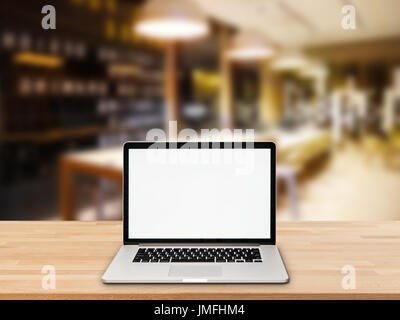 computer notebook with blank screen on wooden table Stock Photo