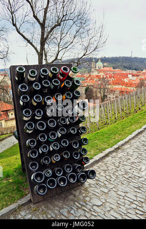 Collection sparkling wines aging in the rack outdoors against old town Prague, Czech Republic Stock Photo