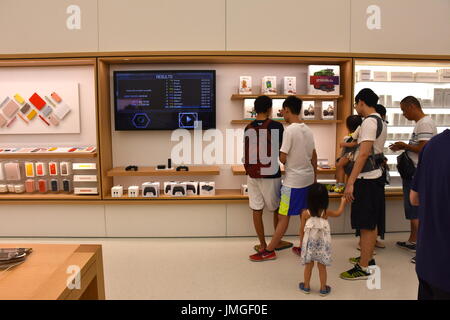 Customers looking at gaming accessories at the grand opening of the 1st Apple headquarters located in Taipei 101 building, Taipei, Taiwan. Stock Photo