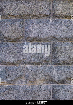 Wall texture of tiled granite stone bricks Stock Photo