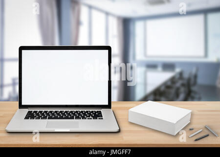 blank screen notebook on wooden table Stock Photo