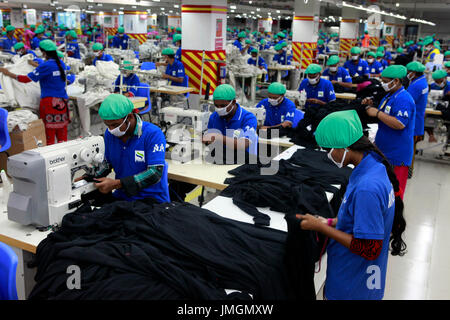 Workers in a sewing section of a ready-made garment factory in Gazipur on the outskirts of Dhaka, Bangladesh on June 22, 2014. Bangladesh is the secon Stock Photo