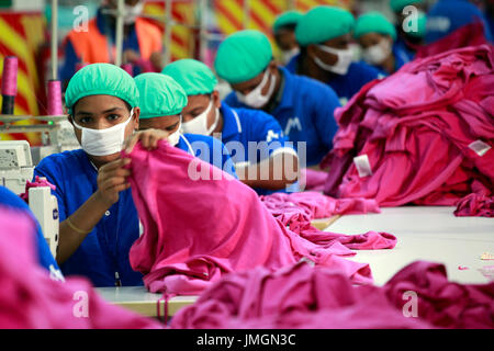 Workers in a sewing section of a ready-made garment factory in Gazipur on the outskirts of Dhaka, Bangladesh on June 22, 2014. Bangladesh is the secon Stock Photo