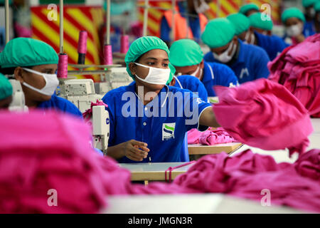 Workers in a sewing section of a ready-made garment factory in Gazipur on the outskirts of Dhaka, Bangladesh on June 22, 2014. Bangladesh is the secon Stock Photo