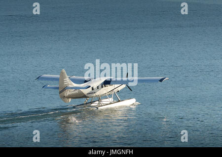 Harbour Air Seaplanes Turbo Otter Floatplane In The Fairmont Hotels Livery, Taxiing In Vancouver Harbour, British Columbia,Canada. Stock Photo