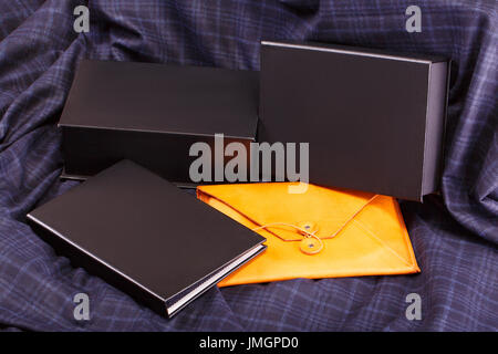 stationery or chancery located on the dark grey fabric Stock Photo