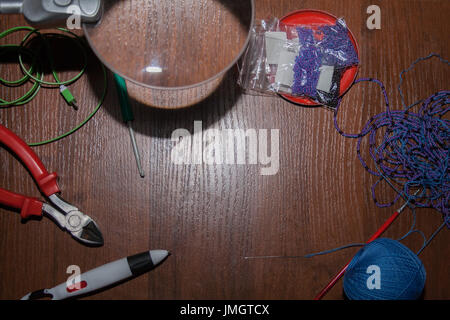 tailoring tools on brown wooden table. background, border. Stock Photo