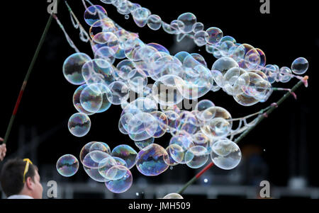 A street artist makes soap bubbles in the evening at the main market in Krakow (Poland). Taken 22.06.2017. The second-biggest city in Poland was European City of Culture in 2000. Photo: Jan Woitas/dpa-Zentralbild/dpa | usage worldwide Stock Photo