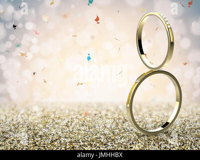 golden wedding rings on gold glitter background Stock Photo