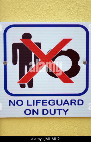 Sign for no lifeguard on duty Stock Photo