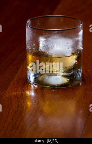 https://l450v.alamy.com/450v/jmj3dj/blended-scotch-whiskey-served-in-a-short-glass-with-a-large-ice-cube-jmj3dj.jpg