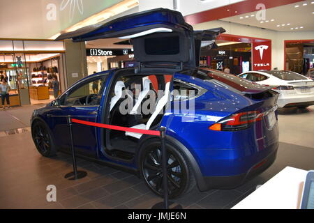 A blue Model X Tesla with open gull wing doors in Taipei, Taiwan show room. July 2017 Stock Photo