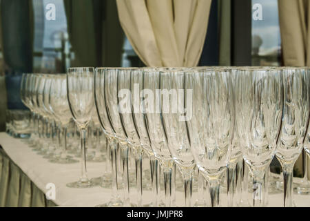 Empty glasses rows on the table in the restaurant Stock Photo