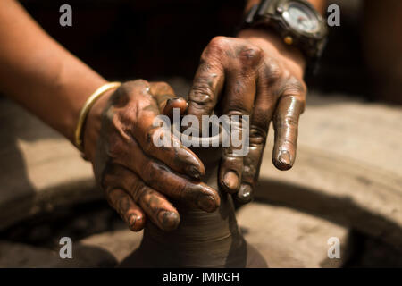 clay potter and hands Stock Photo