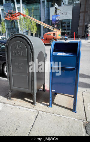 us postal service blue mailbox dropbox and grey relay mail box on