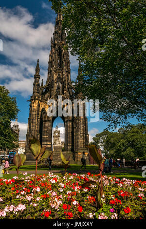 Scott monument, Princes Street, Edinburgh, Scotland, UK, by George Meikle Kemp, with statue of Sir Walter Scott by John Steell and colourful flowers Stock Photo