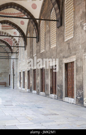 Arched ceiling Portico with doors in a row in the courtyard of an ancient mosque Stock Photo