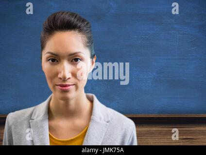 Digital composite of Woman standing with blackboard Stock Photo