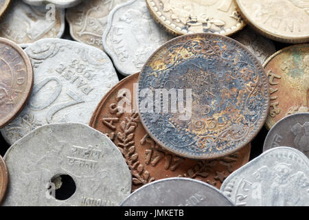 Extreme close up picture of old Indian rupee coins, shallow depth of field. Stock Photo
