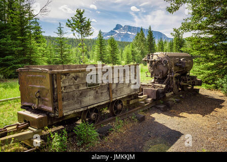 Historic coal mine train in the ghost town of Bankhead with Mt. Rundle in the background located in Banff National Park, Alberta, Canada. Stock Photo