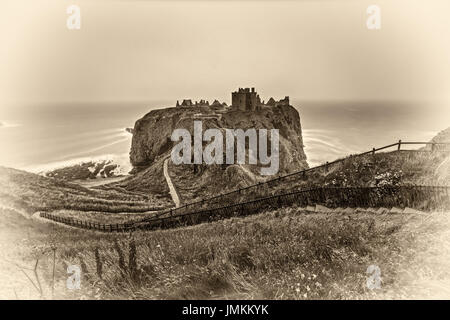 Dunnottar Castle, Scotland, United Kingdom. Vintage black and white processed. Stock Photo