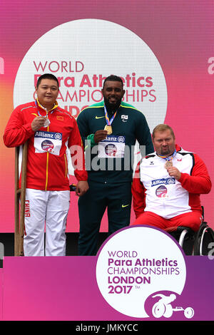 (L to R) Guoshan WU of China (silver) & Thiago Paulino SANTOS of Brazil (gold) & Janusz ROKICKI of Poland (bronze) in the men's Shot Put F57 Final medal ceremony at the World Para Championships in London 2017 Stock Photo
