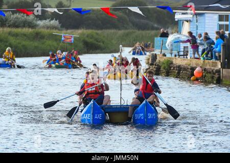 West Bay, Dorset, UK.  27th July 2017.  Annual RNLI Raft Race on the River Brit at the seaside resort of  West Bay in Dorset.  Competitors at the finish line.  Picture Credit: Graham Hunt/Alamy Live News Stock Photo