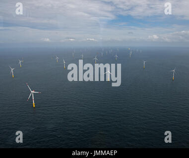 The offshore wind park 'Nordsee 1' can be seen in front of the East Frisian island Spiekeroog, Germany, 27 July 2017. At this moment roughly half of the 54 wind turbines of they type Senvion 6.2M126 have been installed. The complete park will be finished in the upcoming weeks. Parts of the wind park are already in use and have been producing electricity since 2017. The wind park will provide an output of almost 332 MW. Photo: Ingo Wagner/dpa Stock Photo