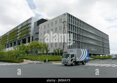 A Sagawa Express delivery truck drives past the Sagawa headquarters on July 28, 2017, Tokyo, Japan. Sagawa Express Co. expects to increase its delivery charges from November 21st due to the increasing demand from online shopping. The company said on Wednesday that its door to door service fee would rise 17.8 percent on average. Competitor Yamato Transport Co. also plans to raise rates in October. Credit: Rodrigo Reyes Marin/AFLO/Alamy Live News Stock Photo