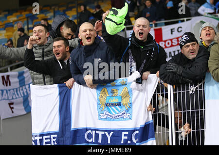 KYIV, UKRAINE - FEBRUARY 24, 2016: FC Manchester City supporters show their support during the UEFA Champions League game against FC Dynamo Kyiv at NSC Olimpiyskyi stadium in Kyiv Stock Photo