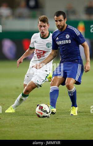 BUDAPEST, HUNGARY - AUGUST 10, 2014: Cesc Fabregas (r) of Chelsea during Ferencvaros vs. Chelsea stadium opening football match at Groupama Arena on August 10, 2014 in Budapest, Hungary. Stock Photo