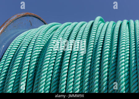 Detail of a big fishing winch with nylon rope Stock Photo