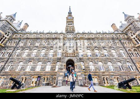 Washington DC, USA - March 20, 2017: Georgetown University on campus with Healy Hall and people walking out of main building Stock Photo