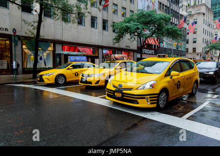 NEW YORK - JULY 2017: The New York City Taxi circa July New York City. Taxicabs with their distinctive yellow paint, are a widely recognized icon of t Stock Photo