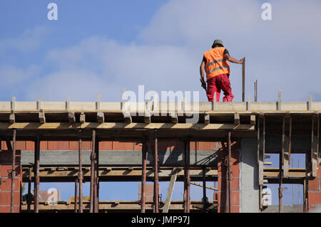 Mason on the construction site Stock Photo