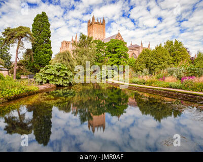 Wells Cathedral reflected in the Well Pools in the grounds of the Bishop's Palace, Wells, Somerset, England, UK. Stock Photo