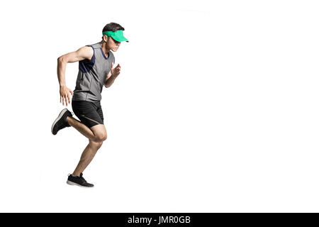 Portrait of an asian sport man wearing sportwear and green visor for running. Isolated full length on white background with copy space Stock Photo
