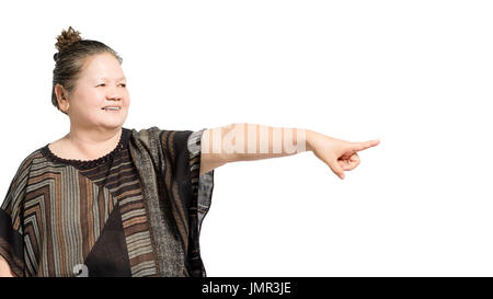 portrait of a mature woman pointed the finger to the right side. Isolated on white background with copt space and clipping path Stock Photo