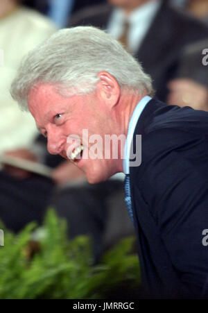 Washington, D.C. - June 14, 2004 -- Former United States President Bill Clinton enjoys a laugh at the White House ceremony where his portrait was unveiled at the White House in Washington, D.C. on June 14, 2004.  Clinton was responding to a remark about his being the campaign chairman for George McGovern's failed presidential bid in Texas in 1972. Credit: Ron Sachs / CNP