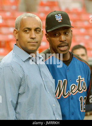 Omar Minaya, right, general manager of the Montreal Expos, announces the  return of the team to Puerto Rico at the San Juan Hotel & Casino in San  Juan, Wed., Dec. 17, 2003.