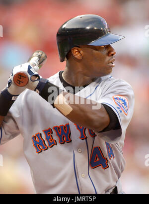 New York Mets' Mike Cameron raises his hand after scoring on a double by Cliff  Floyd against Florida Marlins' Brian Moehler in the fourth inning Friday,  May 27, 2005 in Miami. (AP