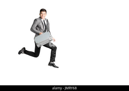 Portrait of a young business man running. Isolated on white background with copy space and clipping path Stock Photo