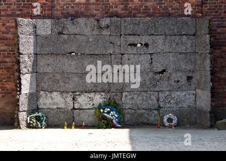 The black wall where prisoners were executed in Auschwitz concentration camp Stock Photo