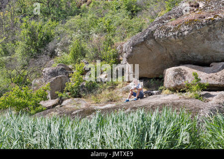 ACTOVE, UKRAINE - JUNE 03, 2017: Famous Ukrainian videographer Andriy Melko launches video shooting quadrocopter in Actove Canyon during photographers Stock Photo