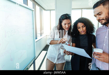 business investors making business plans over a cup of coffee. Women discussing business issues with colleagues. Stock Photo