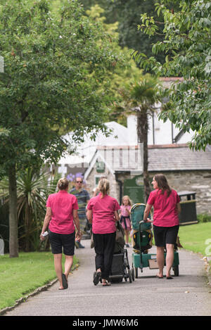 Nursery workers walking around Trenance Gardens in Newquay, Cornwall. Stock Photo